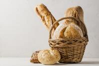 Premium Photo | Basket with various white and whole-grain bread