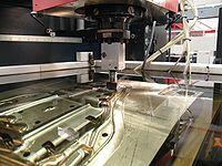 https://upload.wikimedia.org/wikipedia/commons/thumb/1/18/Electrical-discharge-machine.jpg/200px-Electrical-discharge-machine.jpg