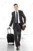 Man Holding Suitcase On Light Background Stock Photo, Picture And Royalty Free Image. Image 94997680.