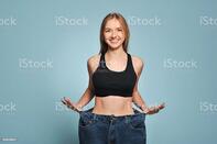 Fit Young Woman In Loose Jeans Stock Photo - Download Image Now - iStock