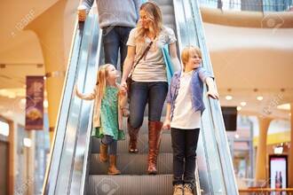 Mother And Children On Escalator In Shopping Mall Stock Photo, Picture And Royalty Free Image. Image 33469182.